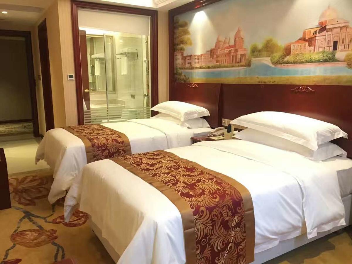 Vienna Hotel Zhongshan Guzhen Town Center Exterior photo